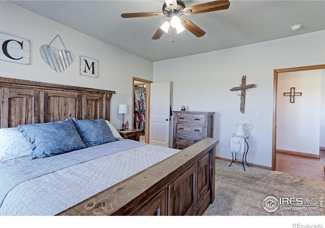 bedroom featuring a ceiling fan, light carpet, and baseboards