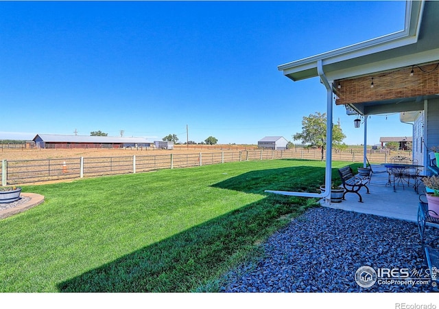 view of yard featuring a patio and a fenced backyard