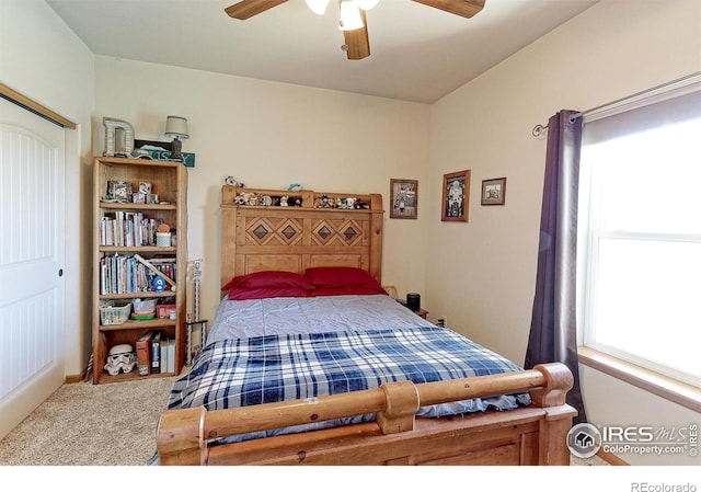 carpeted bedroom featuring a ceiling fan