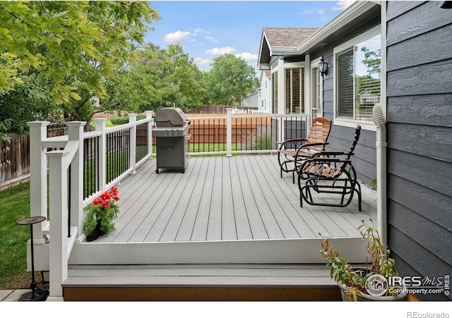 wooden deck featuring grilling area