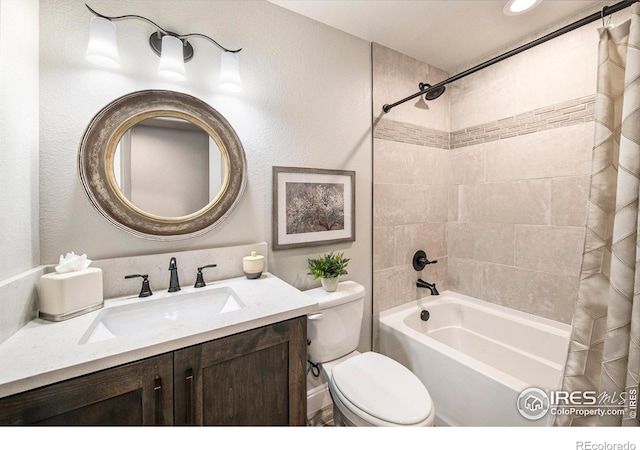 full bathroom featuring shower / bathtub combination with curtain, vanity, and toilet