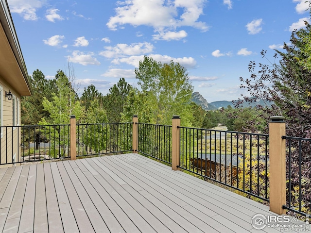 wooden deck featuring a mountain view