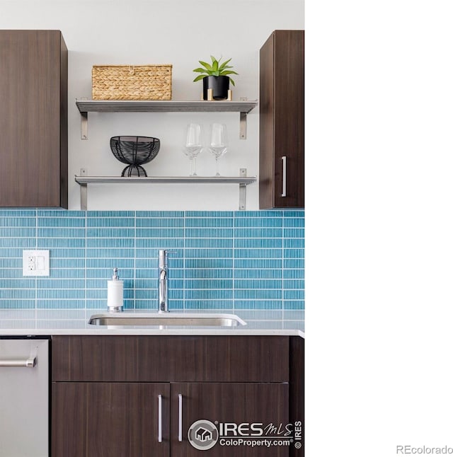 bathroom featuring decorative backsplash and sink