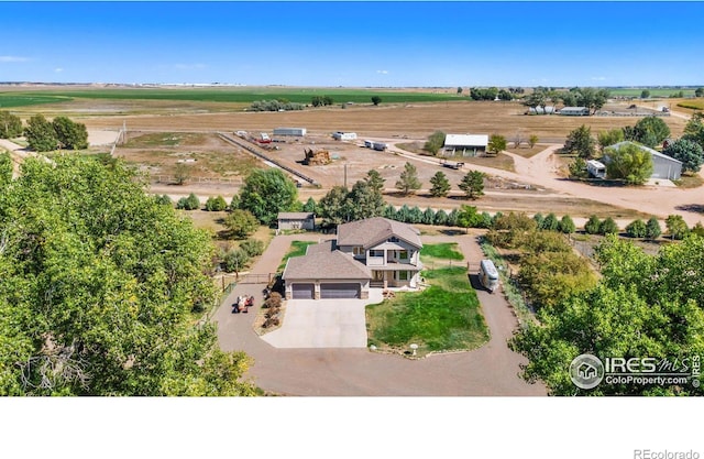 birds eye view of property featuring a rural view