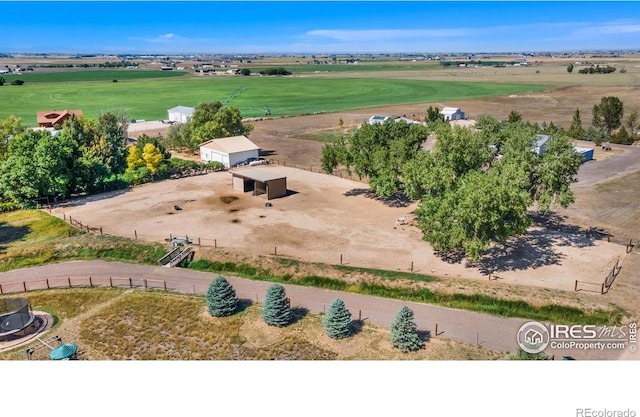 birds eye view of property with a rural view