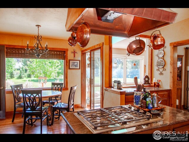 dining area featuring a chandelier and hardwood / wood-style flooring