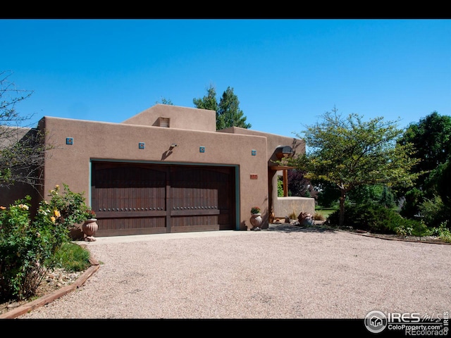 southwest-style home with a garage