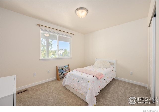 bedroom featuring light colored carpet