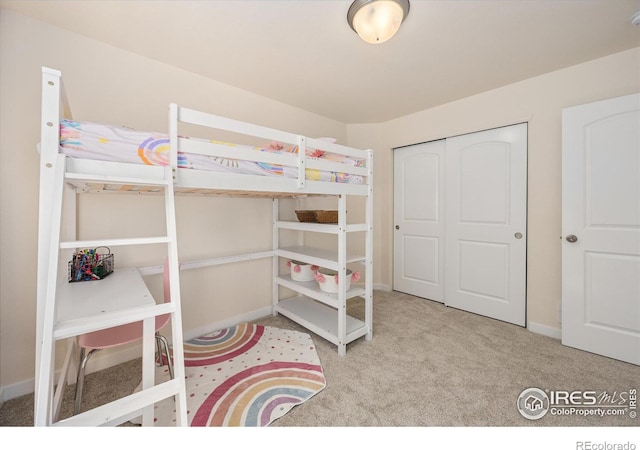 bedroom featuring a closet and carpet floors