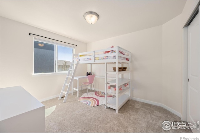 carpeted bedroom with a closet