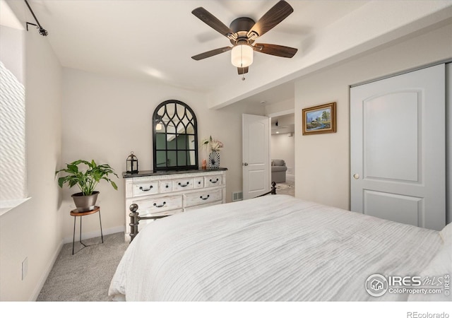 bedroom featuring ceiling fan and carpet