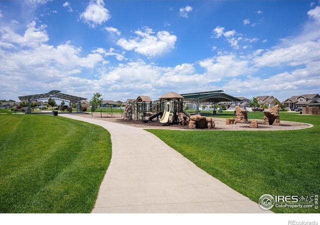 view of home's community with a playground, a gazebo, and a lawn