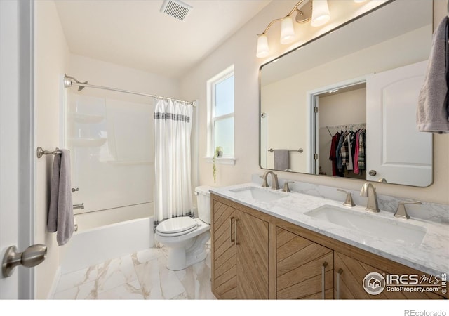 full bathroom with shower / tub combo with curtain, vanity, and toilet