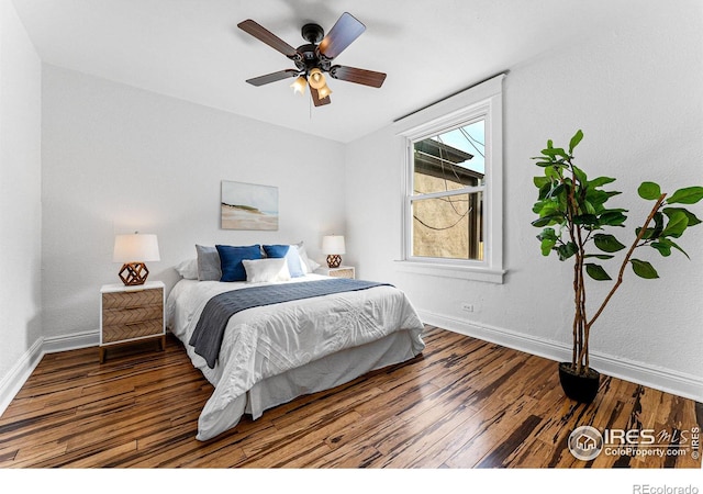 bedroom with hardwood / wood-style flooring and ceiling fan