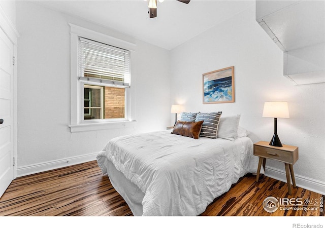 bedroom featuring lofted ceiling, dark hardwood / wood-style floors, and ceiling fan