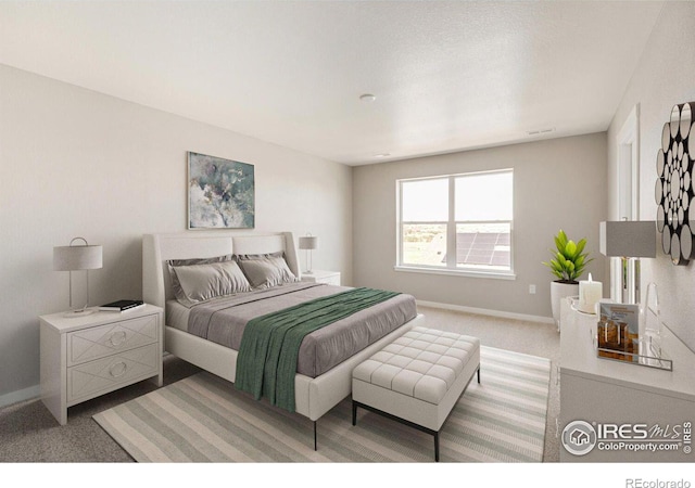 bedroom featuring light colored carpet