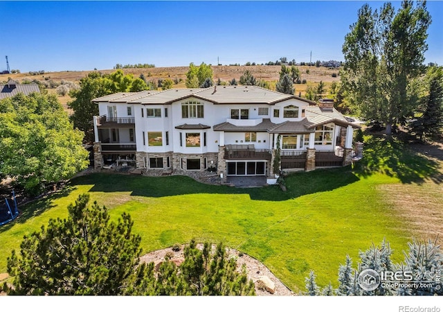 8001 Fairview Rd, Boulder, CO 80303 - back of property featuring a balcony, stone siding, a yard, and stucco siding