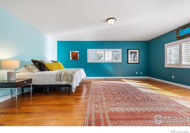 8001 Fairview Rd, Boulder, CO 80303 - bedroom with wood finished floors and baseboards