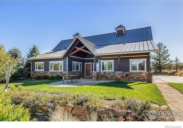 8001 Fairview Rd, Boulder, CO 80303 - back of house with stone siding, a patio, a yard, and metal roof