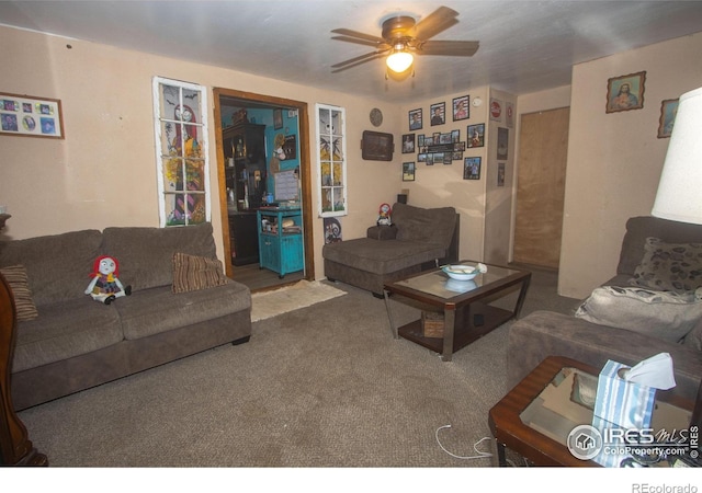 carpeted living room featuring ceiling fan