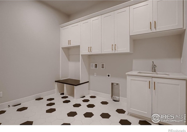 laundry room with washer hookup, hookup for an electric dryer, cabinets, and sink