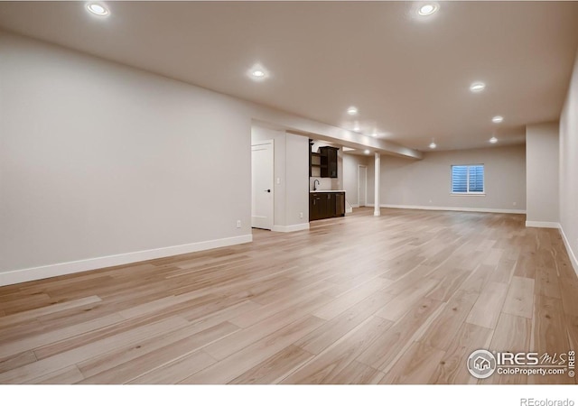 interior space featuring sink and light hardwood / wood-style floors