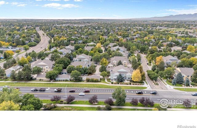 birds eye view of property with a mountain view