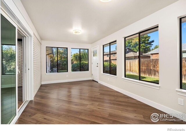 empty room featuring dark hardwood / wood-style flooring