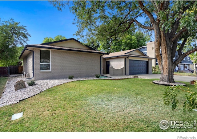 single story home with a front yard and a garage