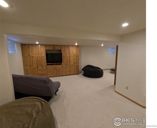 interior space with carpet floors, baseboards, and recessed lighting