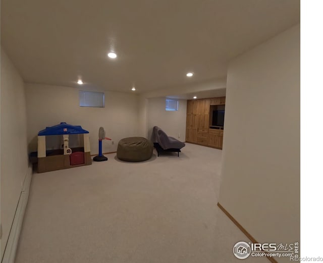 rec room with carpet, baseboard heating, and recessed lighting