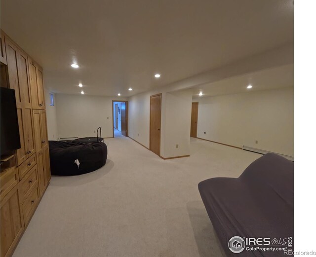 interior space featuring recessed lighting, light carpet, and baseboard heating