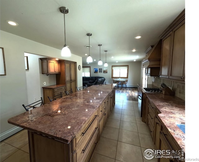 kitchen featuring light tile patterned floors, custom range hood, open floor plan, backsplash, and recessed lighting