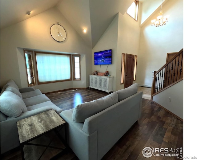 living area featuring a chandelier, high vaulted ceiling, stairway, and wood finished floors