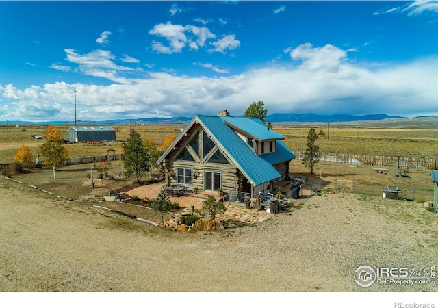 exterior space with a mountain view and a rural view