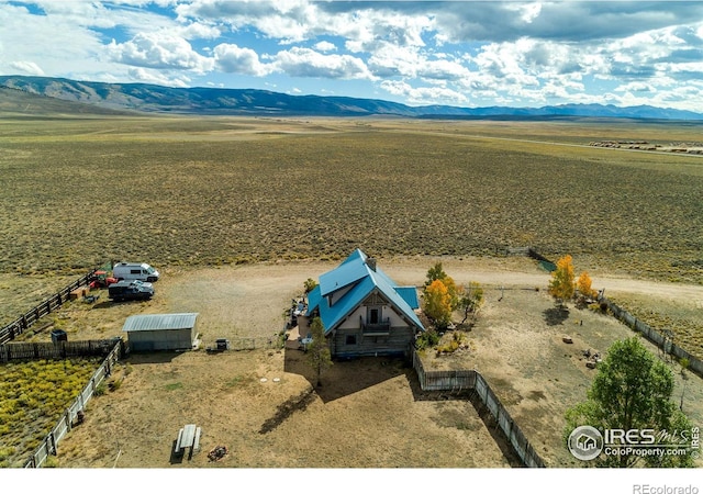 aerial view with a mountain view and a rural view