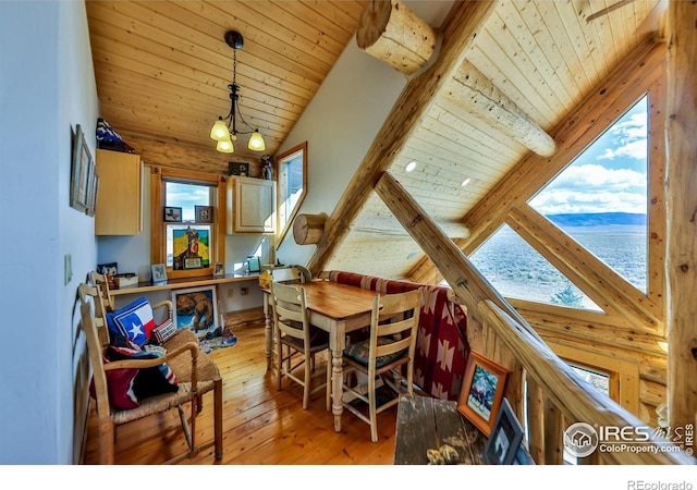 dining area with wood ceiling, light hardwood / wood-style floors, and a wealth of natural light