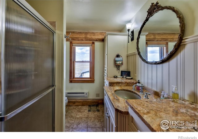 bathroom featuring a baseboard radiator, walk in shower, tile patterned floors, vanity, and toilet