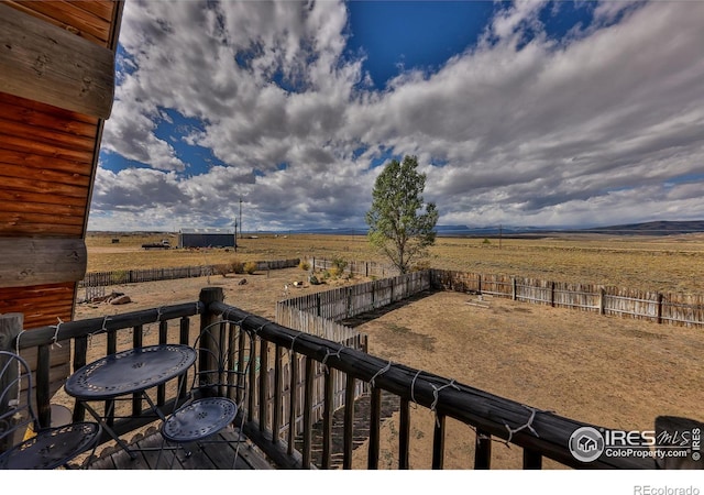 wooden deck featuring a rural view