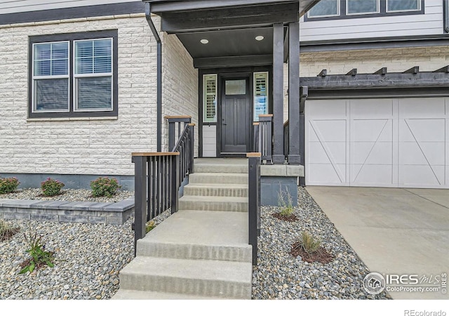 view of exterior entry with a garage