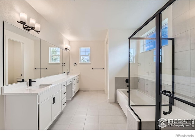 bathroom with tile patterned floors, vanity, and plus walk in shower