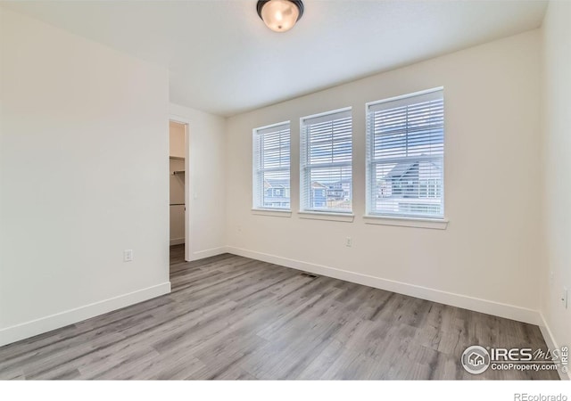 empty room with light wood-type flooring