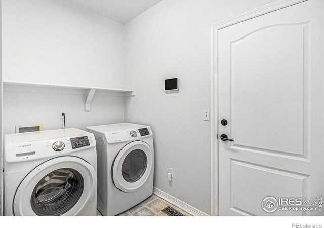 laundry area with washer and dryer