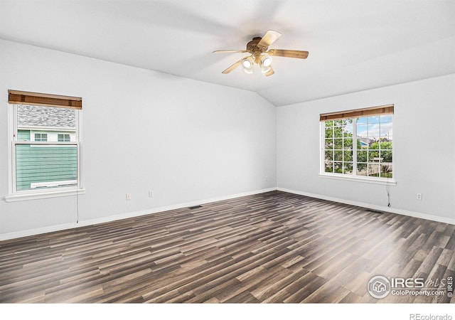 unfurnished room featuring ceiling fan, lofted ceiling, and dark hardwood / wood-style flooring