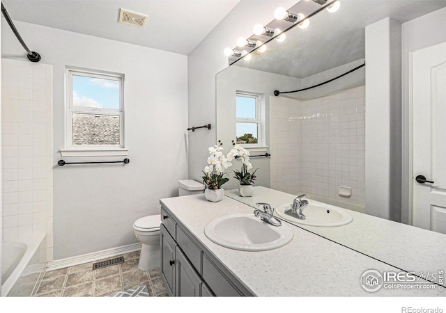 full bathroom featuring vanity, toilet, and shower / bathtub combination