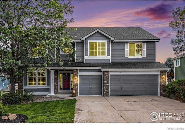 view of front of property featuring a garage