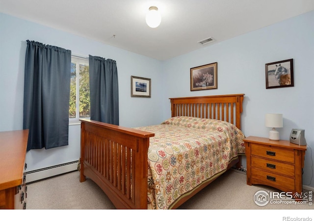 carpeted bedroom featuring a baseboard radiator