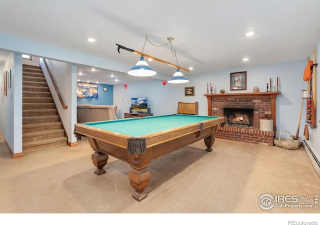 playroom featuring pool table, light colored carpet, and a brick fireplace