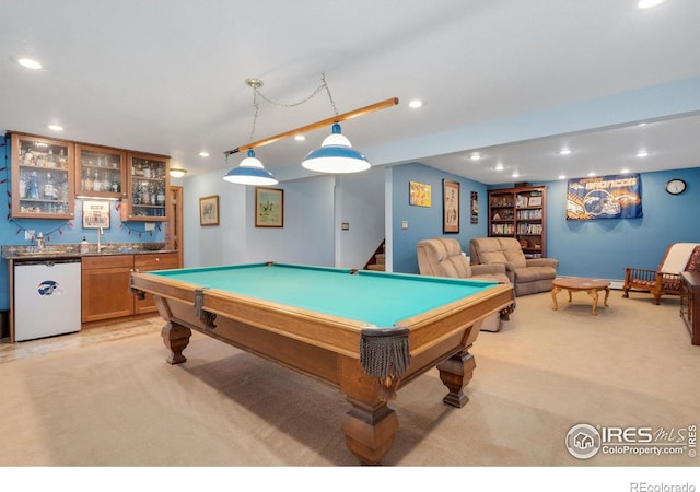 rec room with light carpet, indoor bar, and pool table