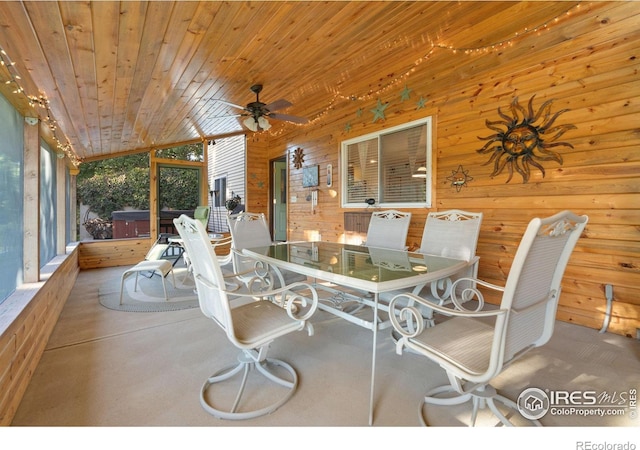 sunroom / solarium with wood ceiling, vaulted ceiling, and ceiling fan